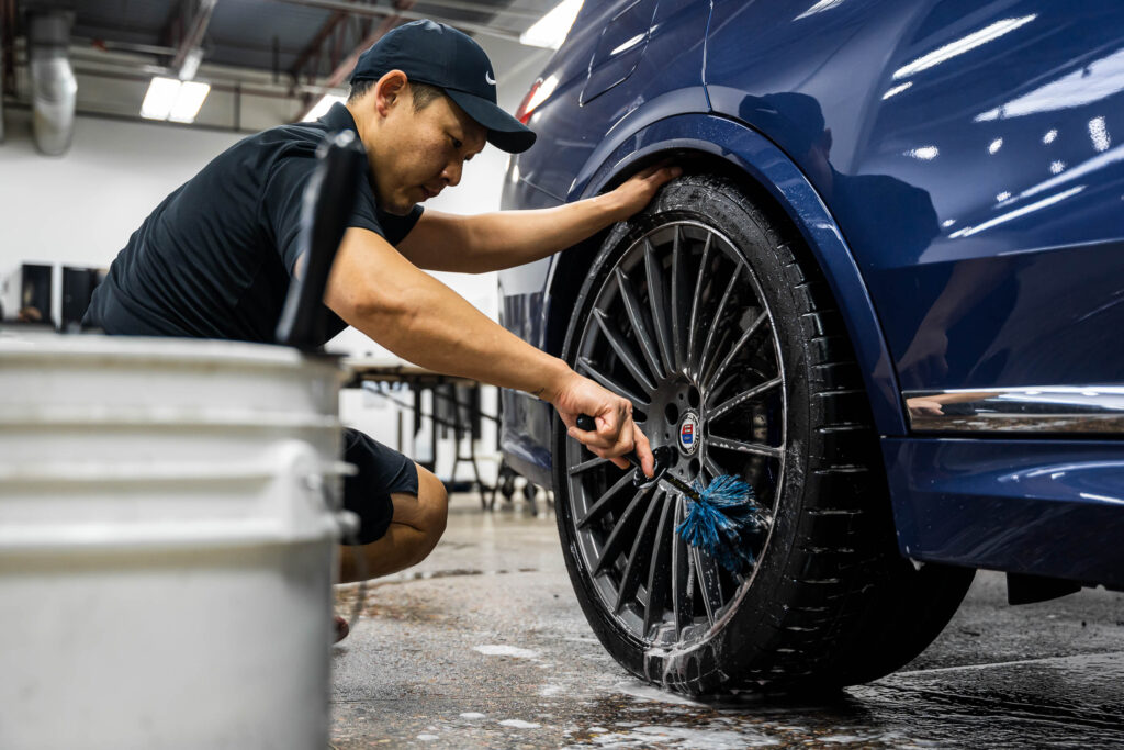 Cleaning wheels with long brush