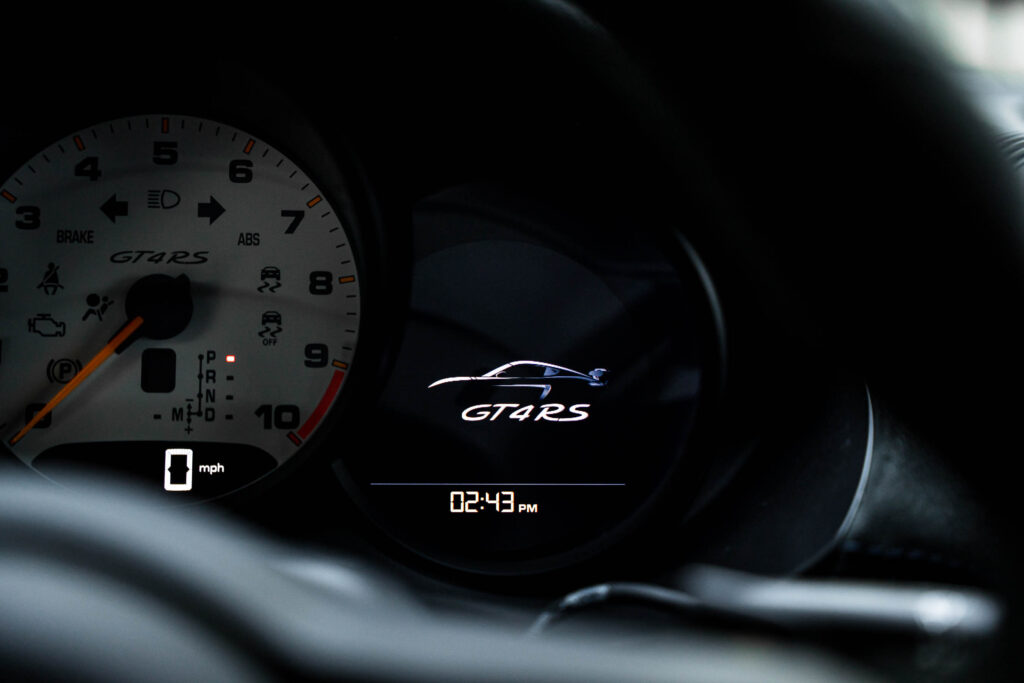 Close up of GT4 RS logo in gauge cluster