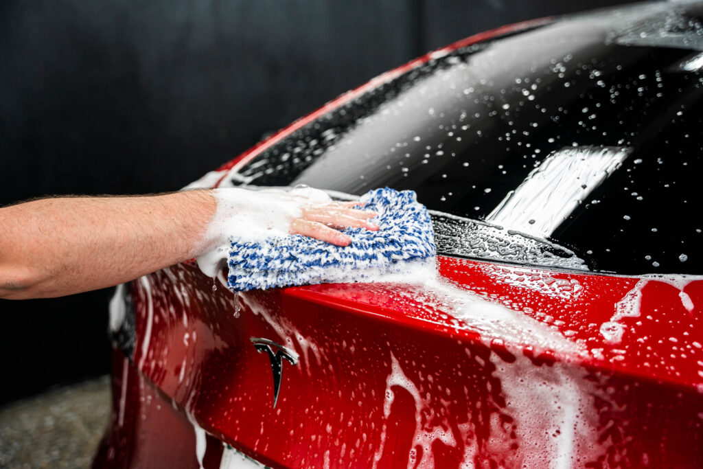 Using a wash mitt to clean paint