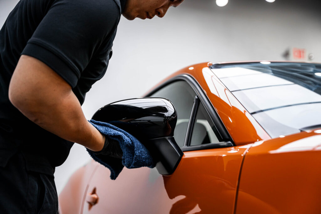 Removing excess ceramic coating from mirror