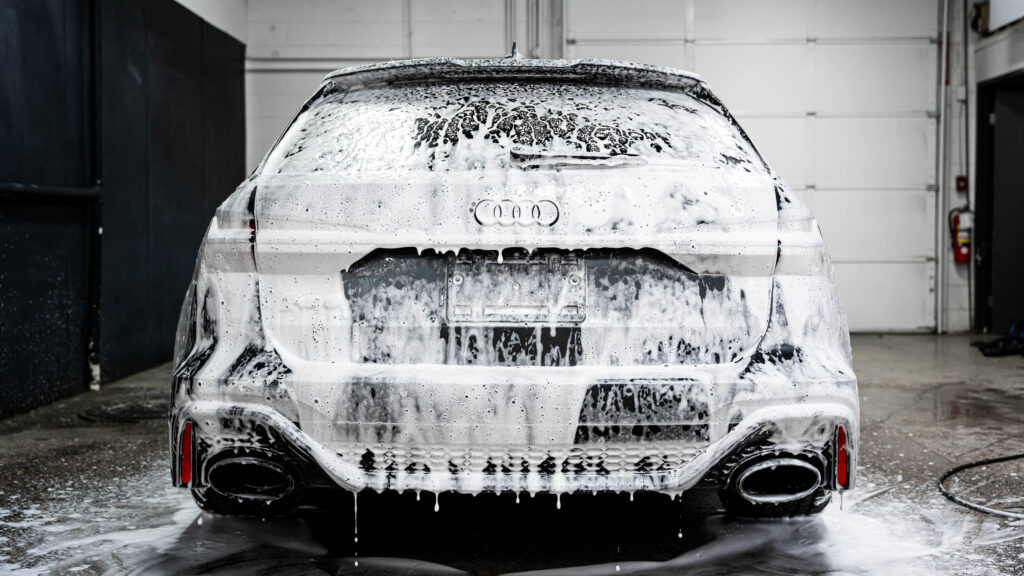 Snow foam resting on vehicle