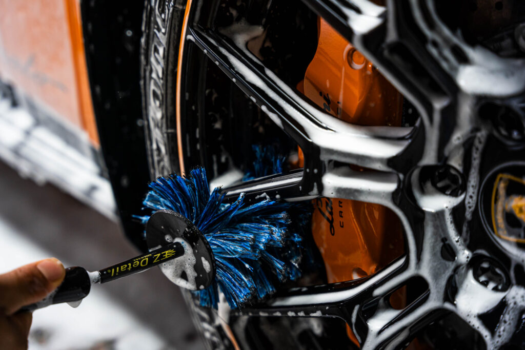 Using a special brush to clean wheels