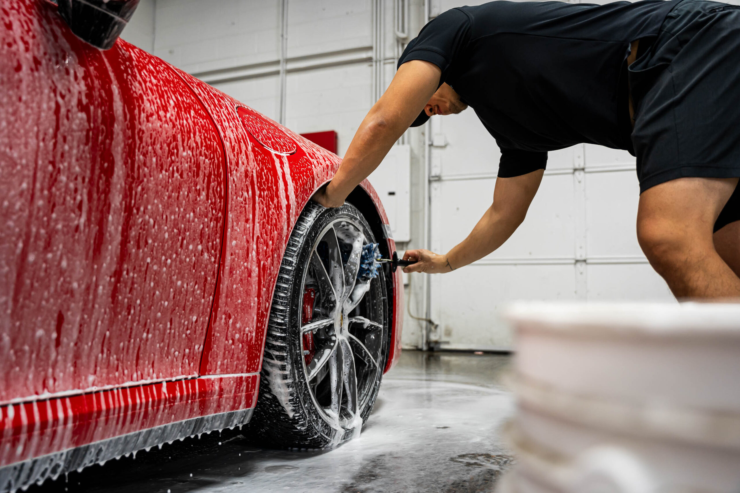 Using specialized brush to clean wheels